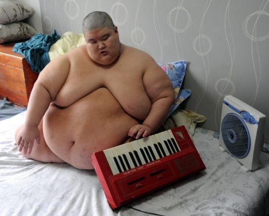 A Fire Brigade Bathe Obese Man In China