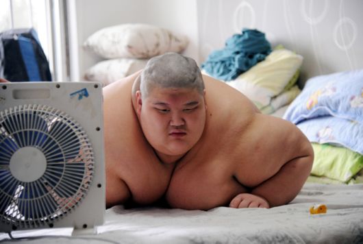 A Fire Brigade Bathe Obese Man In China