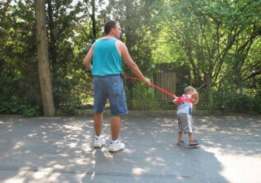 Parents Walk Their Kids On Leashes